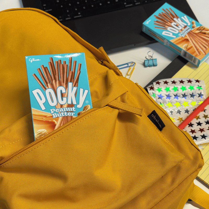 Pocky Peanut Butter regular size box in a yellow backpack